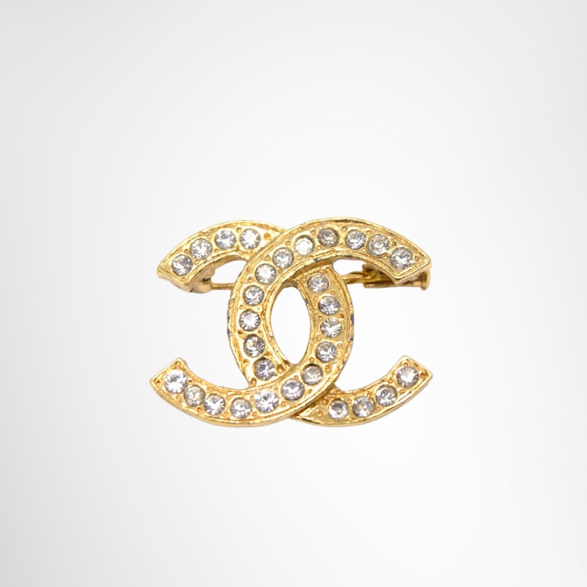 Chanel CC Logo Studded Clear Rhinestone Brooch – Pre-Owned Luxury Accessory – Antonio & Co –Front Page