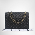 Chanel Preowned Luxury Bag Maxi Double Flap Bag in Quilted Caviar Back View