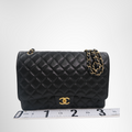 Chanel Preowned Luxury Bag Maxi Double Flap Bag in Quilted Caviar Front View 2