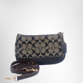 Coach Preowned Luxury Signature Canvas Leather Bag Front View with Strap - Antonio & Co.