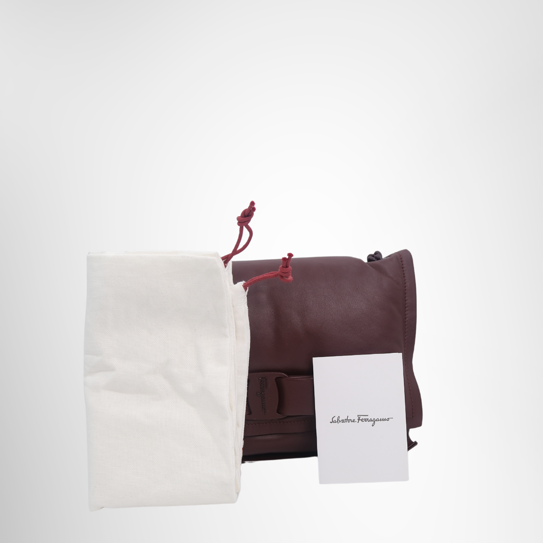 Ferragamo Preowned Luxury Viva Bow Shoulder Bag in Maroon Front View with Pouch and Card - Antonio & Co.