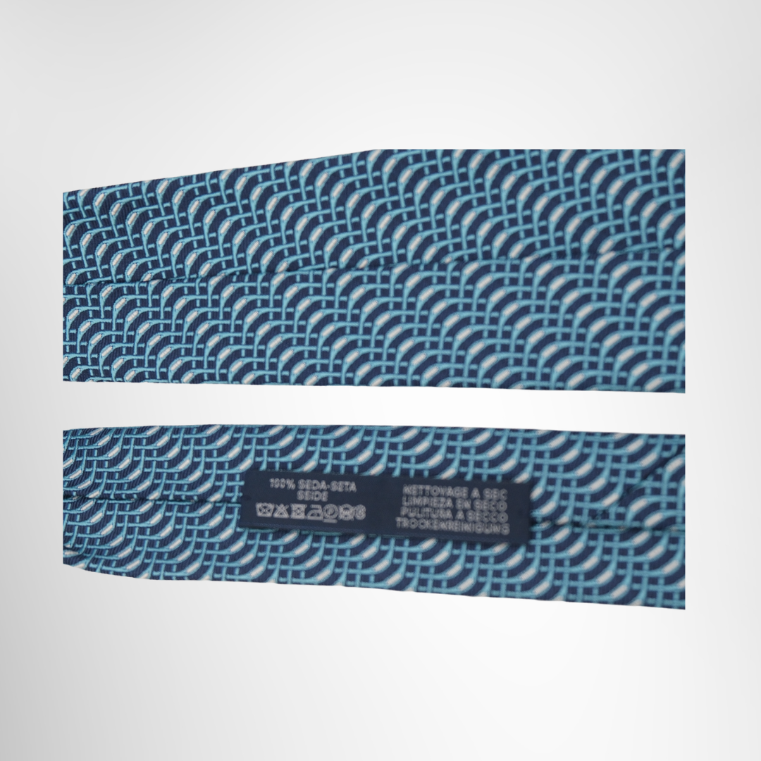 Hermes Preowned Luxury Necktie Light Blue & Navy Close Up View With Brand Tag