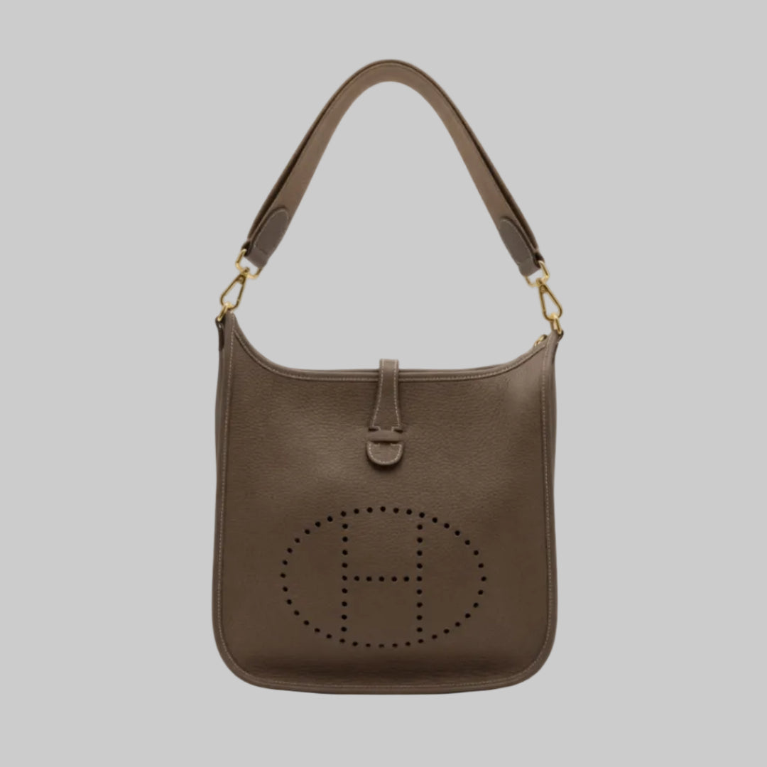 Hermes Preowned Luxury Taurillon Etoupe Evelyn III PM Bag Front Page - Antonio & Co.