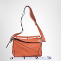 Loewe Preowned Luxury Bag Puzzle Bag in Vibrant Orange Front View 3