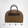 Louis Vuitton Preowned Luxury Bag Nolita Satchel in Damier Ebene Canvas Front View 2