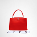 Louis Vuitton Preowned Luxury Capucines MM Bag Front View - Antonio & Co.