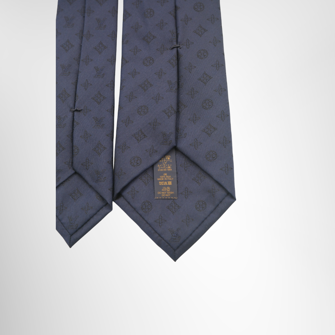 Louis Vuitton Preowned Luxury Monogram Shadow Tie Close up View With Brand Tag