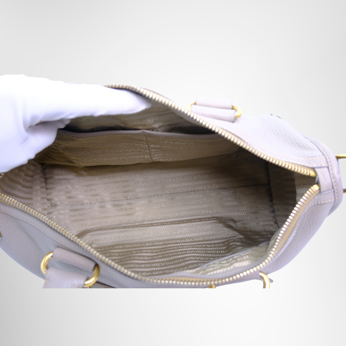 Prada Preowned Luxury Bauletto Vitello Daino Front Zip Satchel Bag Inside View - Antonio & Co.