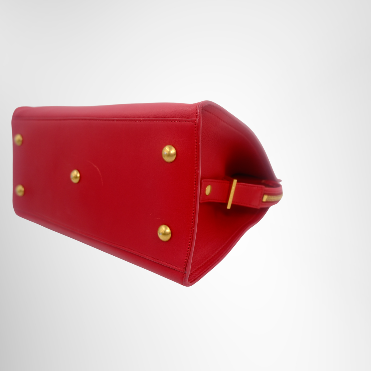 Saint Laurent Preowned Luxury Tassel Satched Cabas Bag Bottom Side View1 - Antonio & Co.